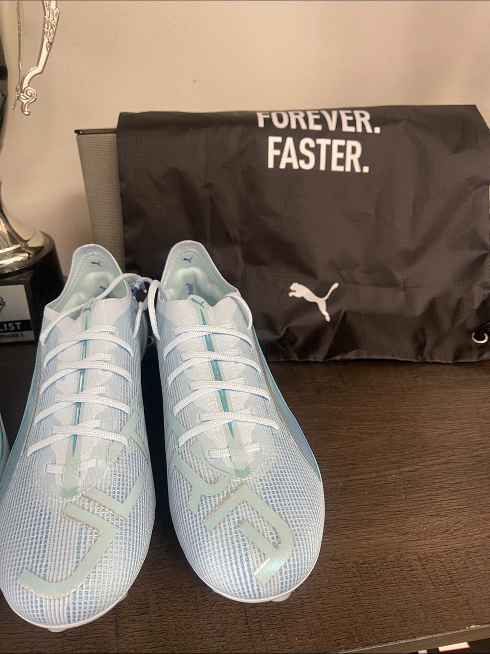 Puma Men's Light Blue Athletic Cleats with Mint Accents